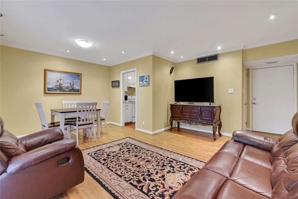 2824 Briarhurst Drive, Unit 12 Houston, TX 77057 - Photo 1 of 27 a living room with furniture and a flat screen tv