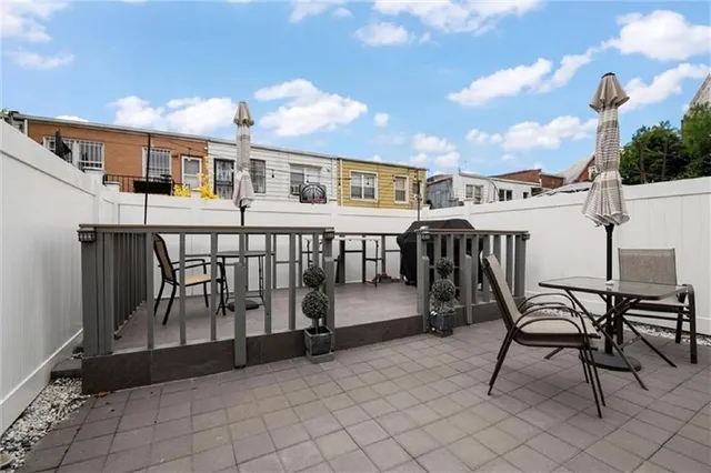 a view of a balcony with chairs