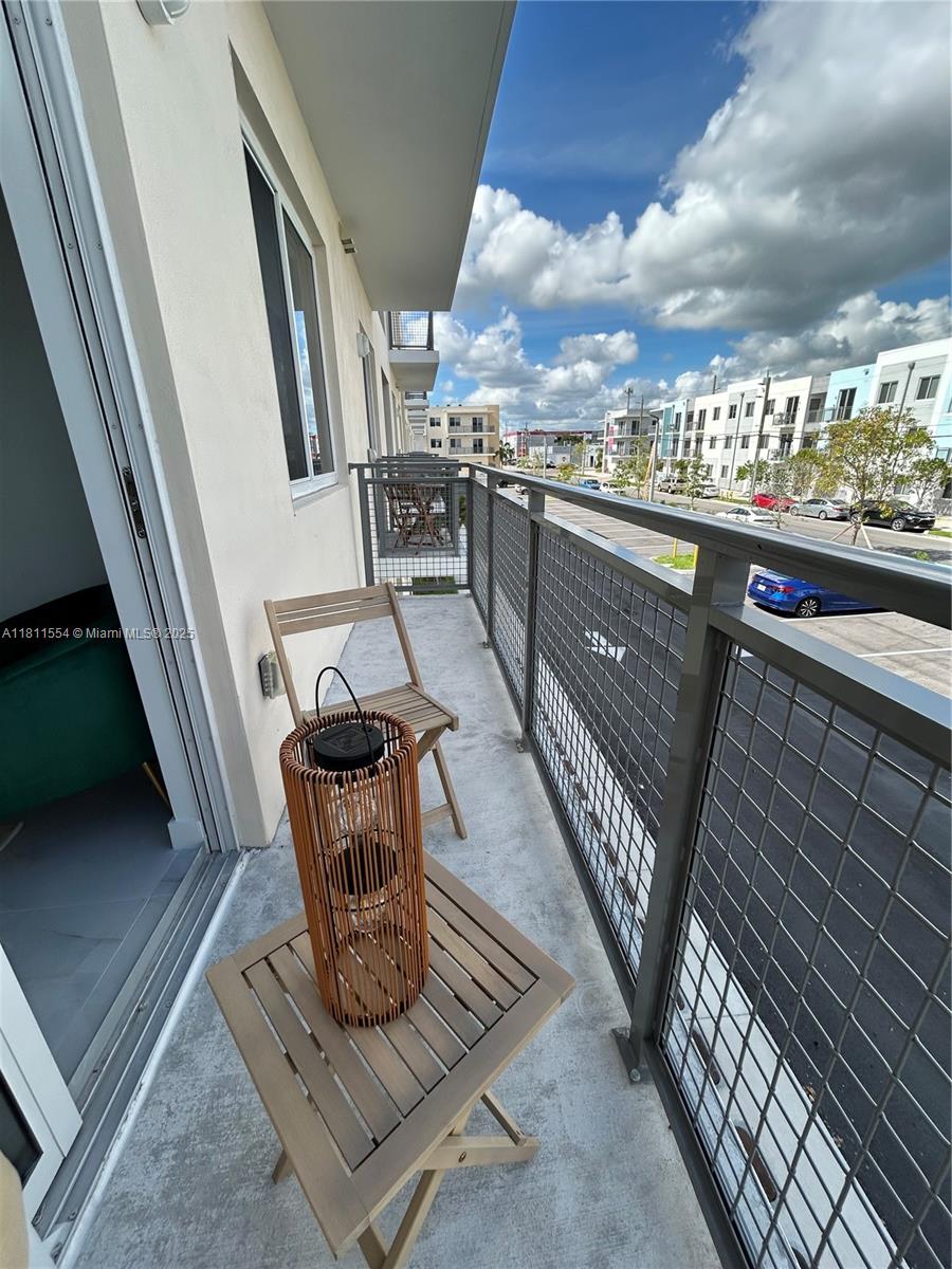 1010 Southwest 69th Avenue, Unit 212 Miami, FL 33144 - Photo 13 of 30 a view of a balcony with chairs