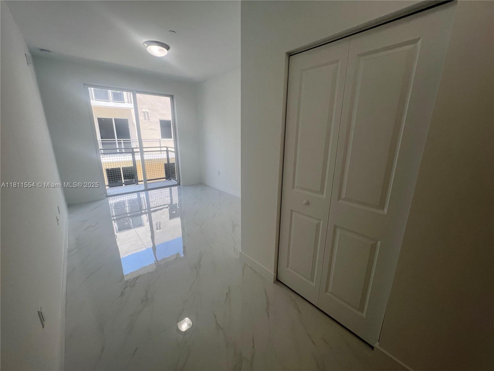 1010 Southwest 69th Avenue, Unit 212 Miami, FL 33144 - Photo 18 of 30 an empty room with windows