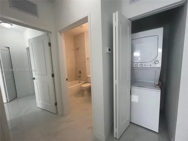 a view of an empty room with a window