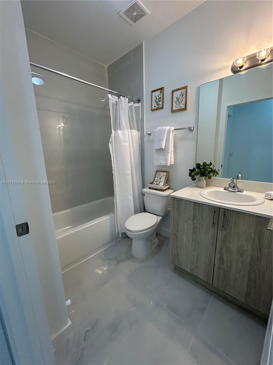 1010 Southwest 69th Avenue, Unit 212 Miami, FL 33144 - Photo 23 of 30 a bathroom with a sink toilet and shower