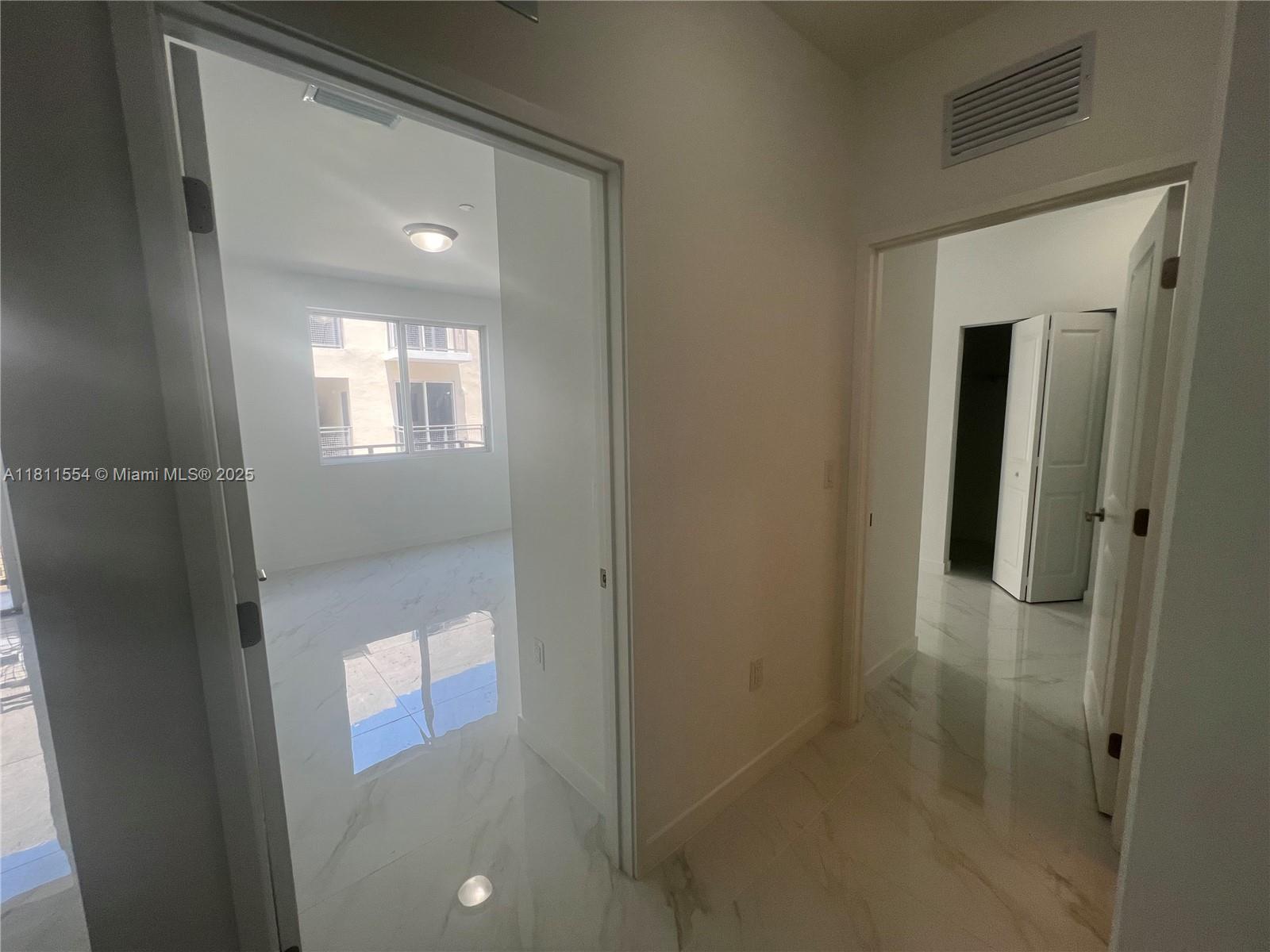 1010 Southwest 69th Avenue, Unit 212 Miami, FL 33144 - Photo 26 of 30 view of a bathroom with windows