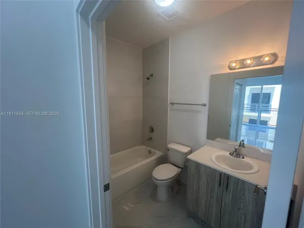 a utility room with washing machine