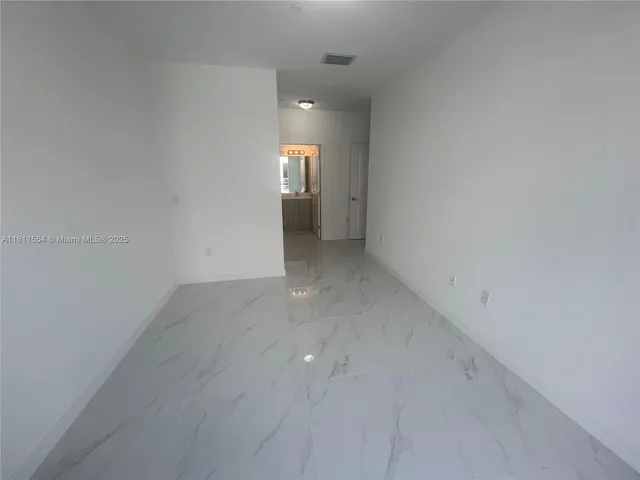 a utility room with washing machine