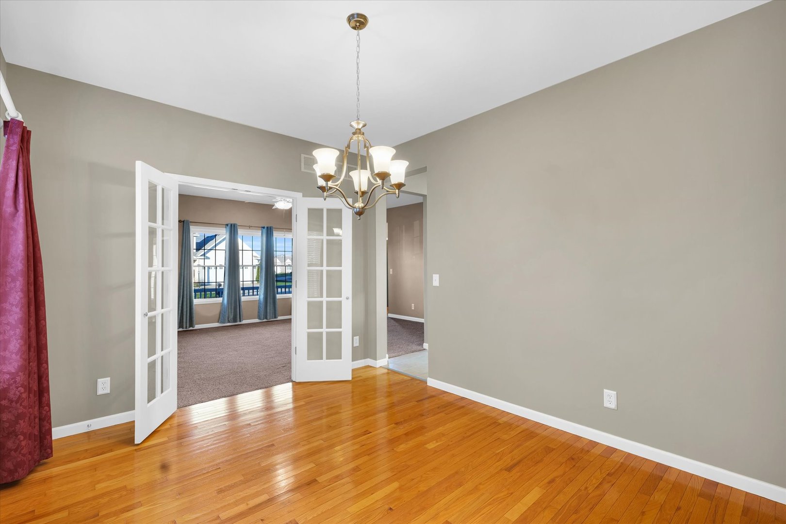 1330 West Ridge Lane Champaign, IL 61822 - Photo 11 of 39 a view of a livingroom with a chandelier wooden floor and a chandelier
