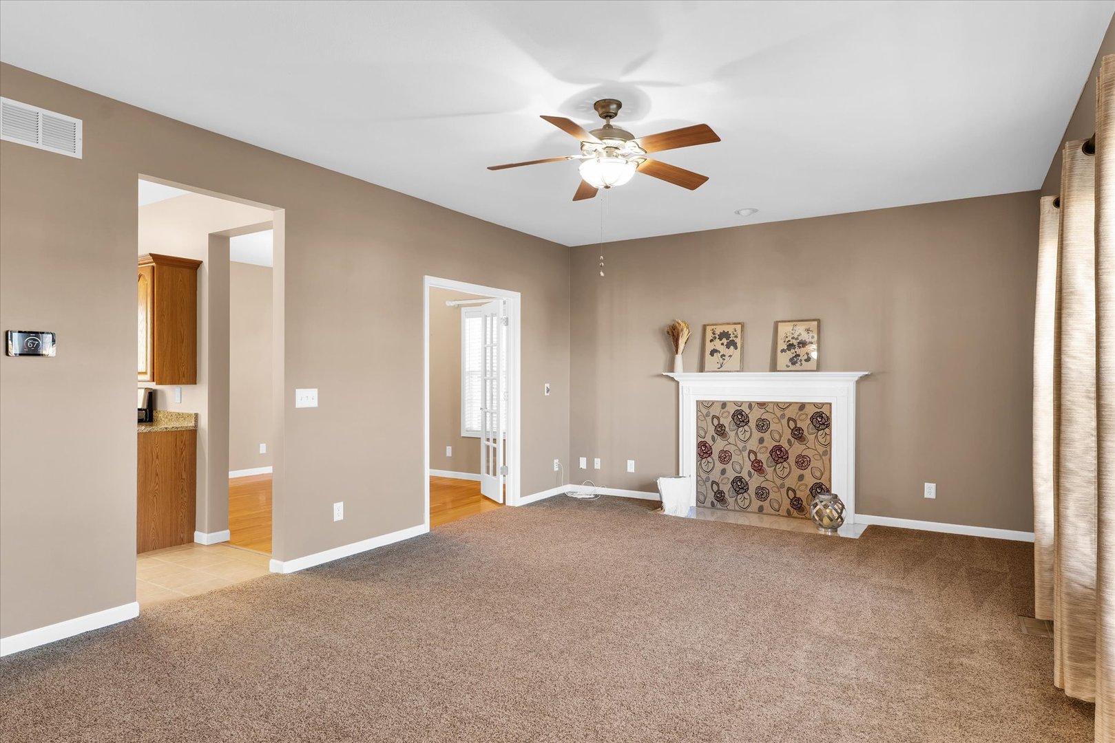 1330 West Ridge Lane Champaign, IL 61822 - Photo 12 of 39 a view of a livingroom with a ceiling fan