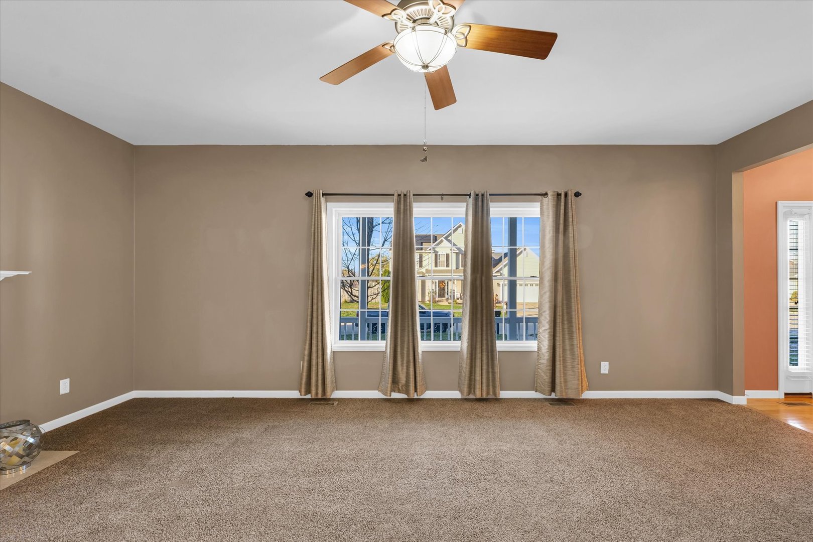 1330 West Ridge Lane Champaign, IL 61822 - Photo 15 of 39 a view of an empty room with chandelier fan