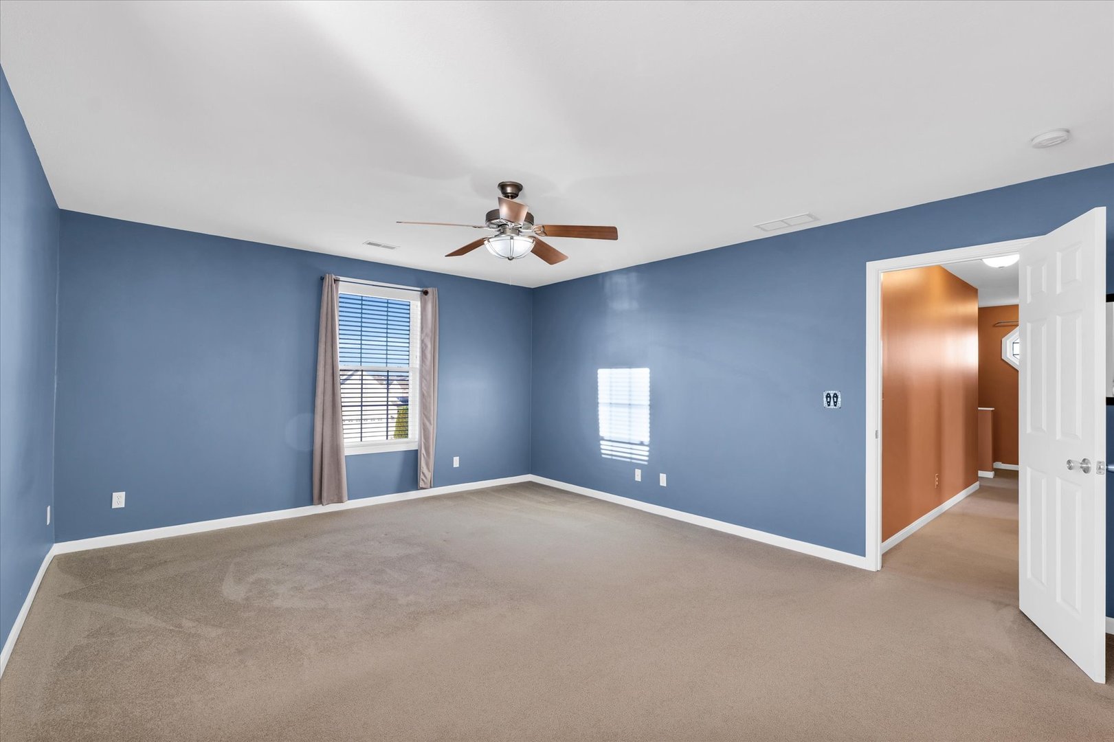 1330 West Ridge Lane Champaign, IL 61822 - Photo 24 of 39 a view of a livingroom with a chandelier fan and windows