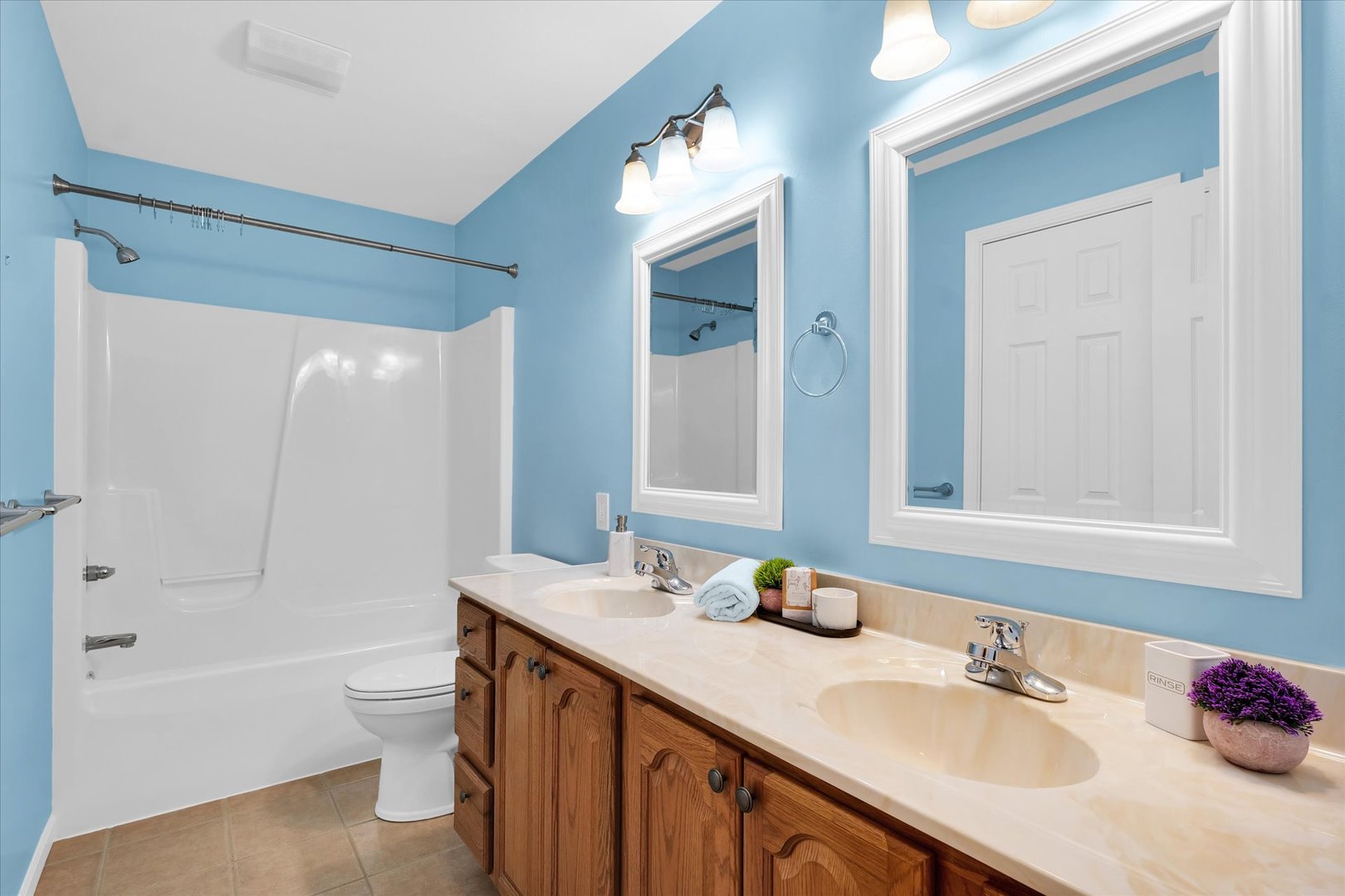 1330 West Ridge Lane Champaign, IL 61822 - Photo 28 of 39 a bathroom with a granite countertop sink and a mirror