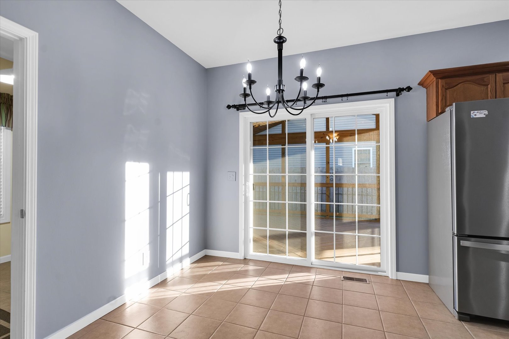 1330 West Ridge Lane Champaign, IL 61822 - Photo 10 of 39 a view of a room with windows and chandelier