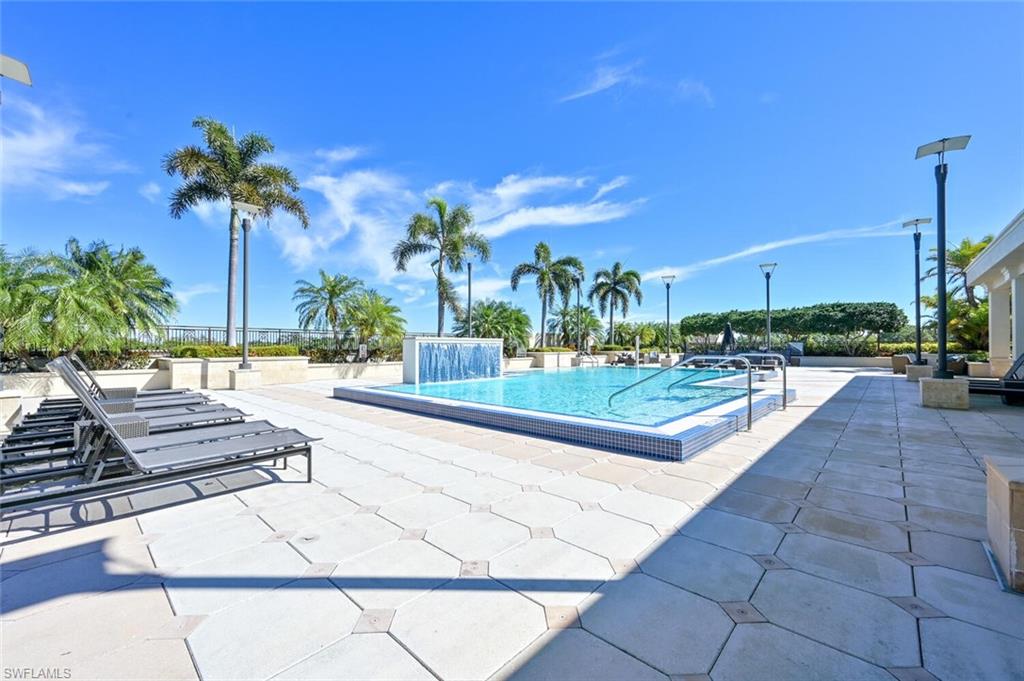 9115 Strada Place, Unit 5211 Naples, FL 34108 - Photo 13 of 31 a view of a swimming pool with a patio
