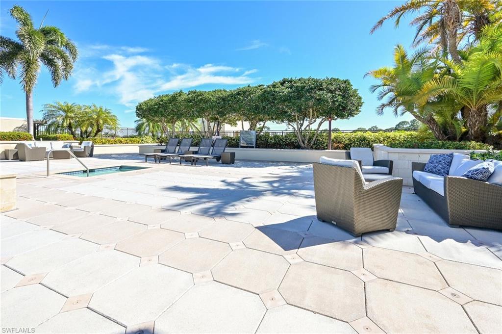 9115 Strada Place, Unit 5211 Naples, FL 34108 - Photo 15 of 31 a view of a patio with swimming pool