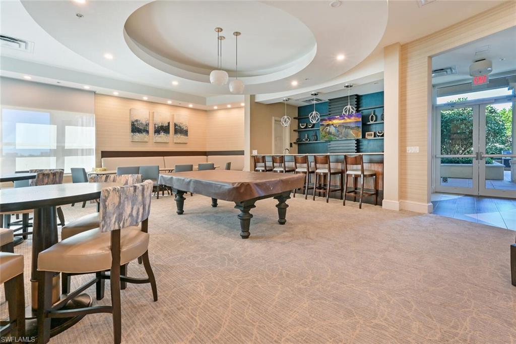 9115 Strada Place, Unit 5211 Naples, FL 34108 - Photo 21 of 31 a room with lots of furniture and view