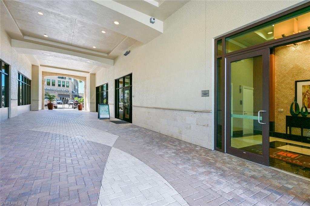 9115 Strada Place, Unit 5211 Naples, FL 34108 - Photo 28 of 31 a view of a building with a porch