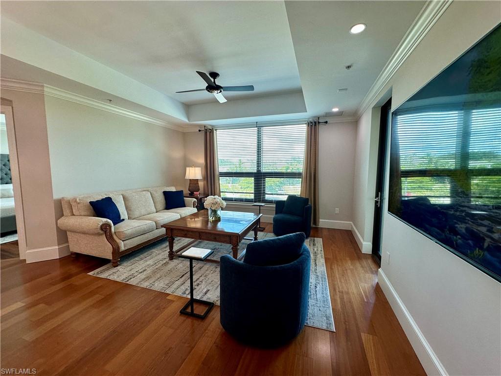 9115 Strada Place, Unit 5211 Naples, FL 34108 - Photo 3 of 31 a living room with furniture and a large window