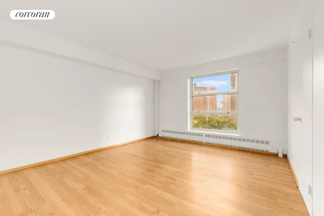 a kitchen with stainless steel appliances granite countertop a sink a stove and a refrigerator with wooden floor