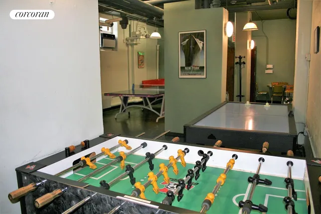 a room with furniture and air hockey table