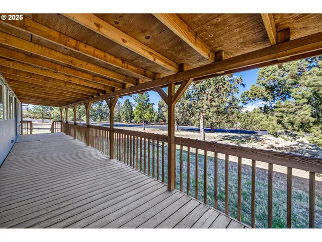 a view of balcony with wooden floor