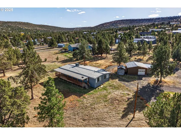 a view of a city with mountains in the background