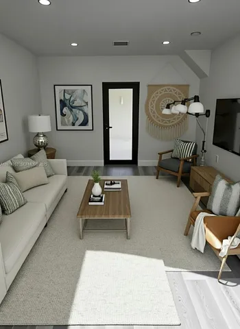 a living room with furniture and a table