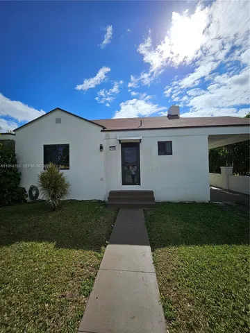 a view of a back yard of the house