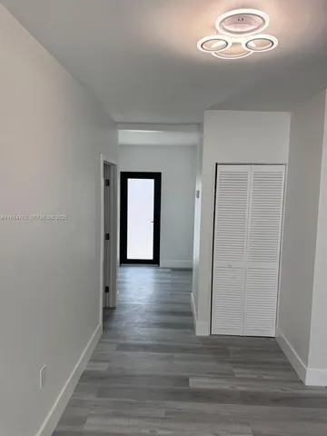 a view of a livingroom with wooden floor