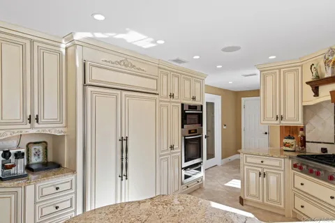 a kitchen with stainless steel appliances a refrigerator and cabinets