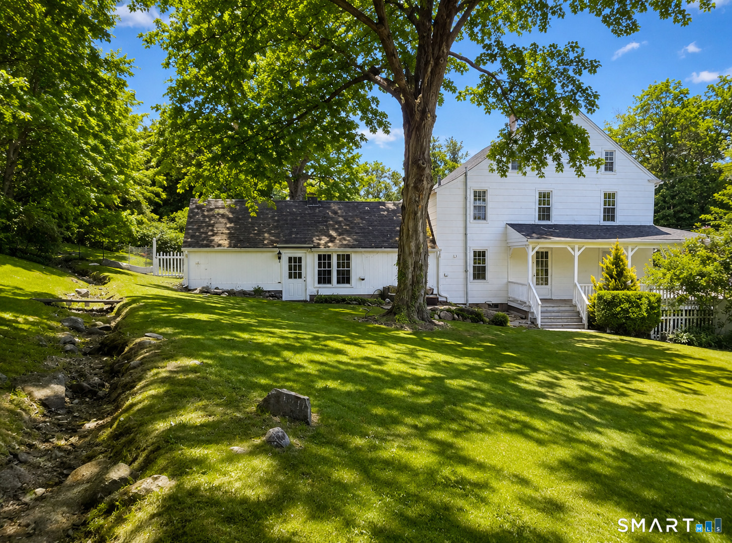 443 Amity Road Bethany, CT 06524 - Photo 2 of 30 a front view of house with yard and green space