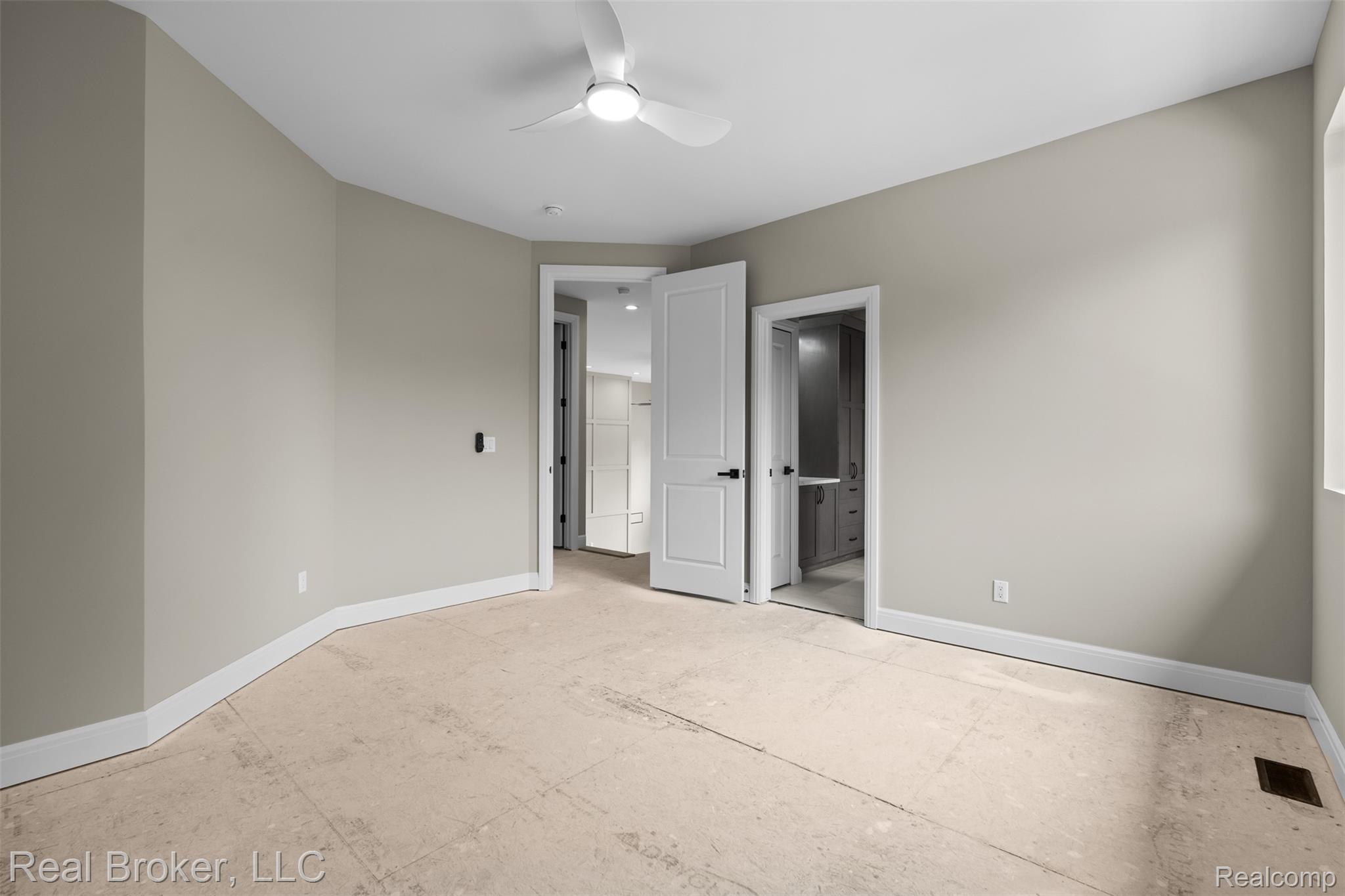 12114 22 Mile Road Utica, MI 48315 - Photo 49 of 70 Neutral wall paint, white trim, and a ceiling fan with integrated lighting