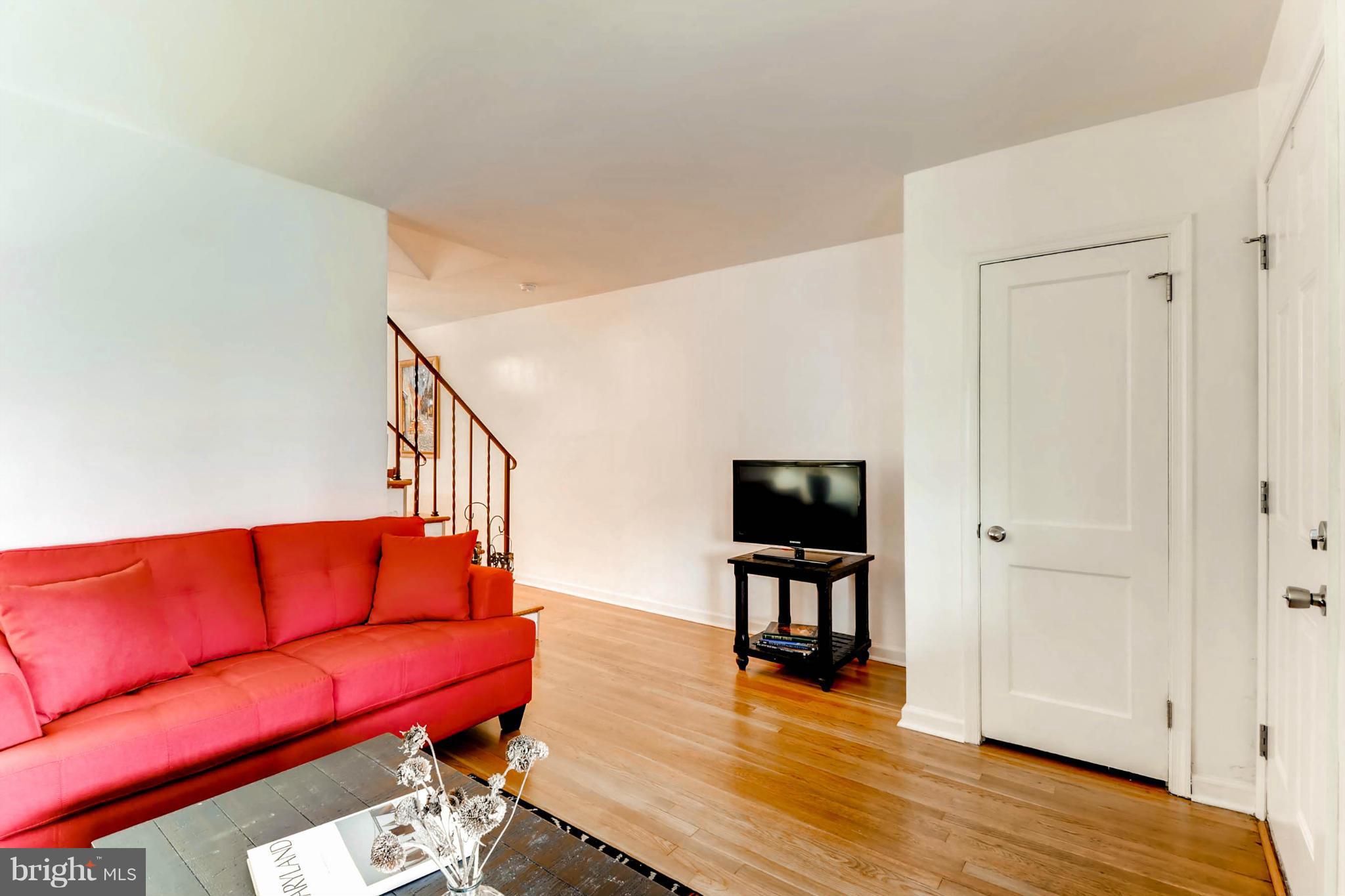 8405 Kavanagh Road Baltimore, MD 21222 - Photo 19 of 30 a living room with furniture and a flat screen tv