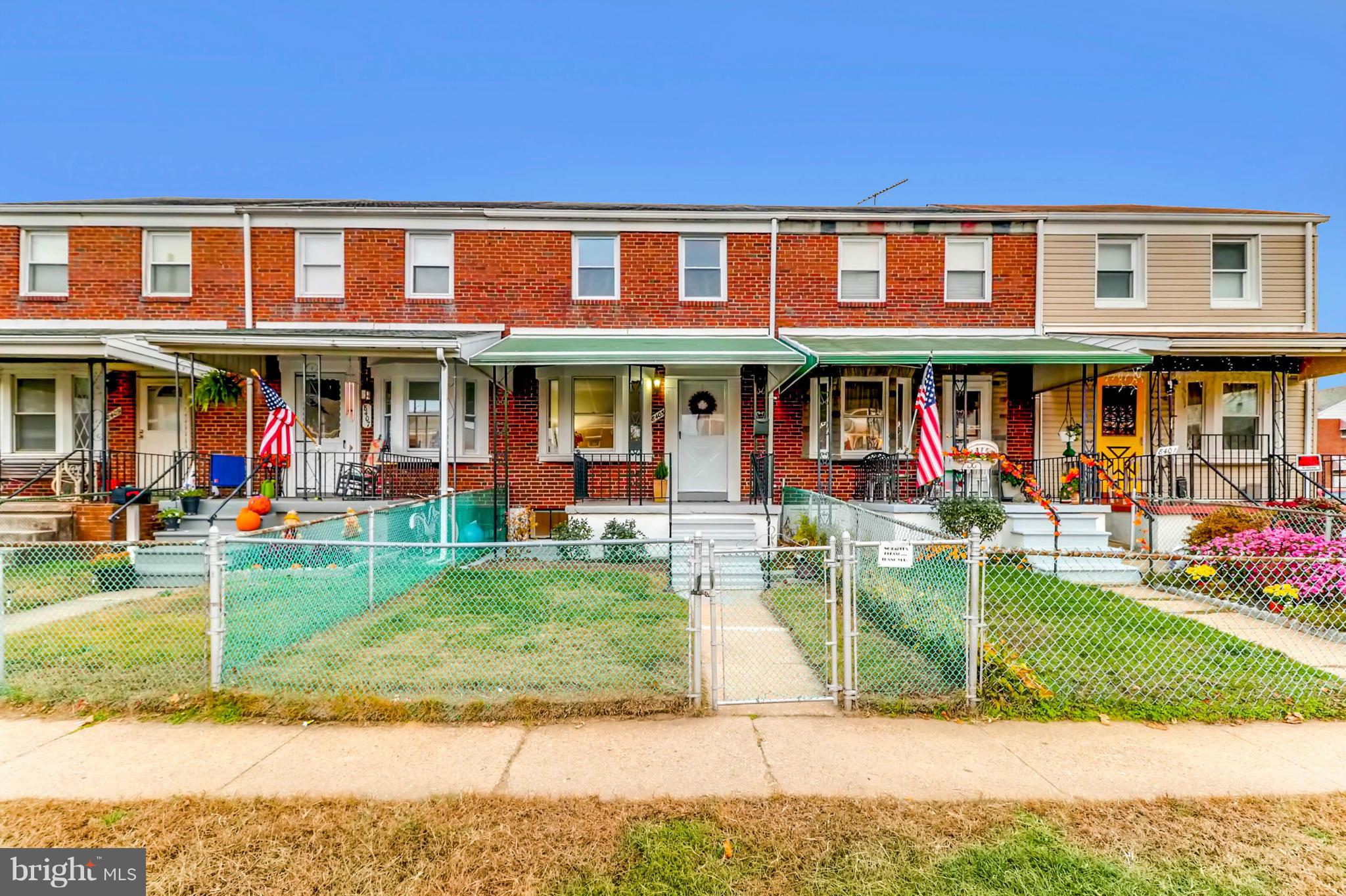 8405 Kavanagh Road Baltimore, MD 21222 - Photo 3 of 30 a front view of a house with a yard