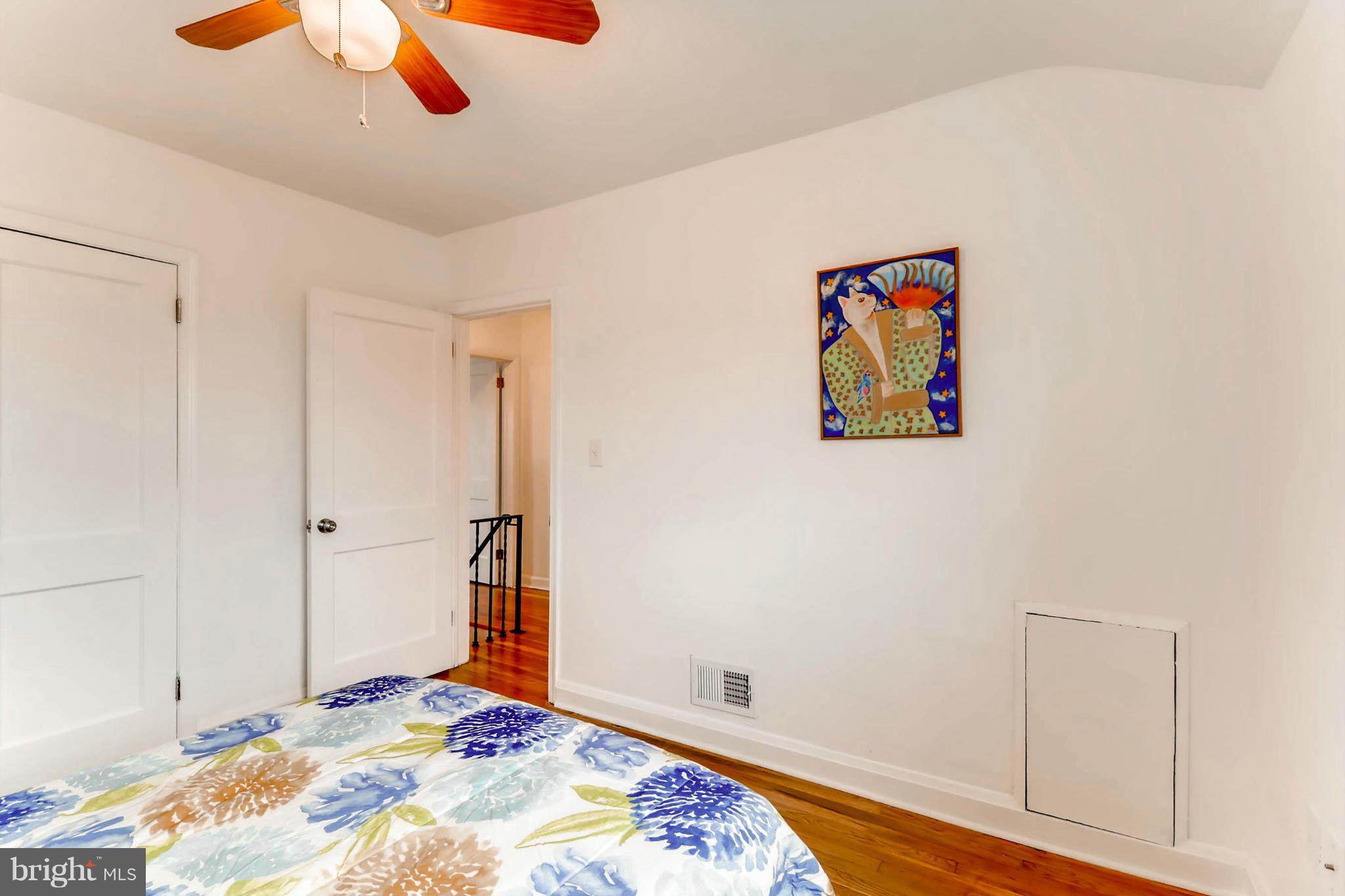 8405 Kavanagh Road Baltimore, MD 21222 - Photo 24 of 30 a bedroom with a bed and a chandelier