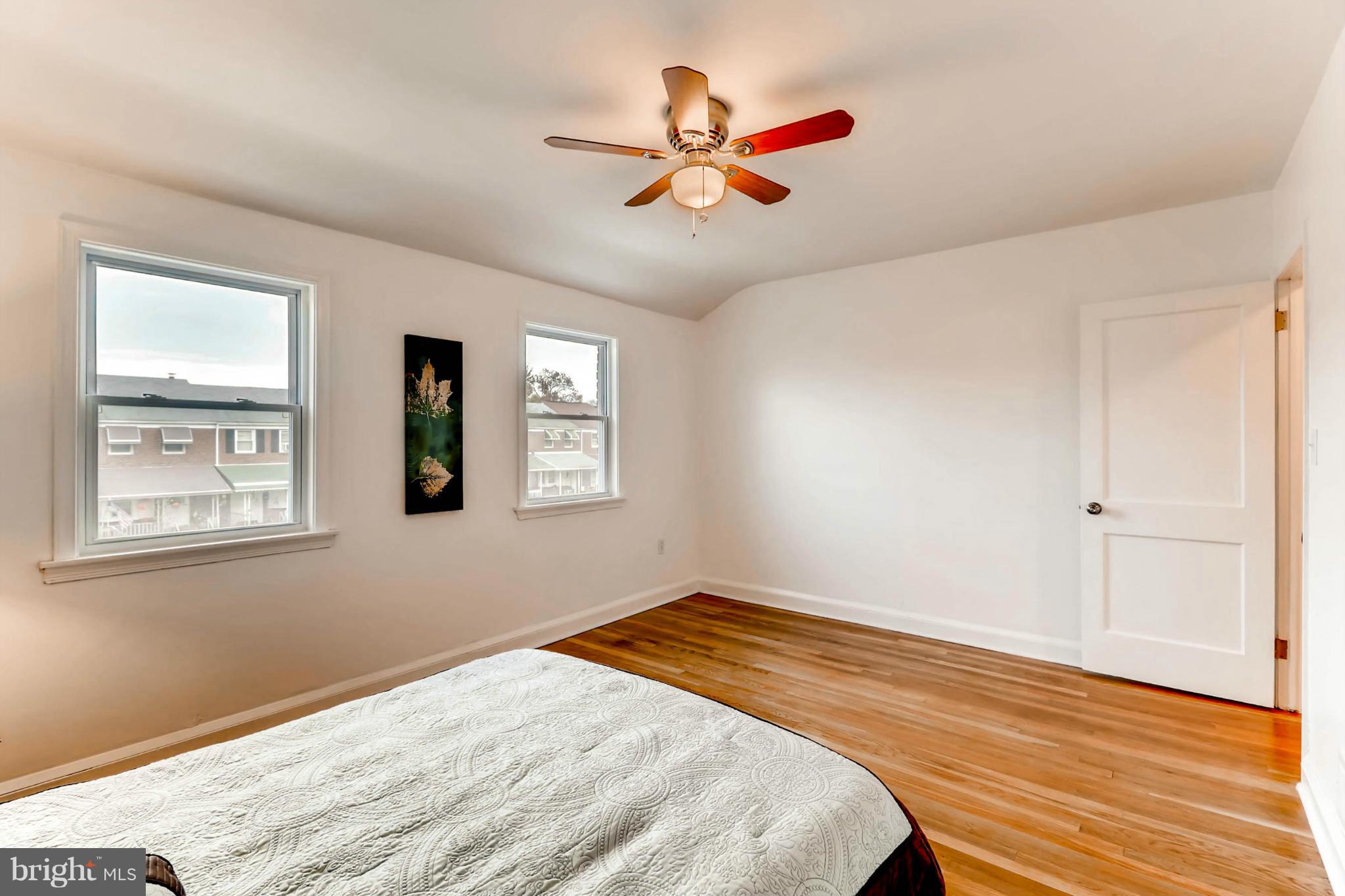 8405 Kavanagh Road Baltimore, MD 21222 - Photo 27 of 30 a bedroom with a bed and a window