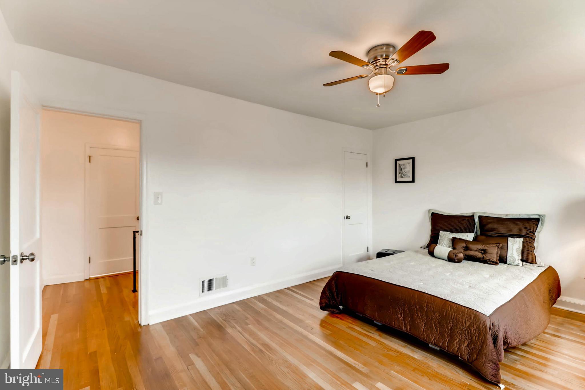 8405 Kavanagh Road Baltimore, MD 21222 - Photo 29 of 30 a bedroom with a bed and a ceiling fan