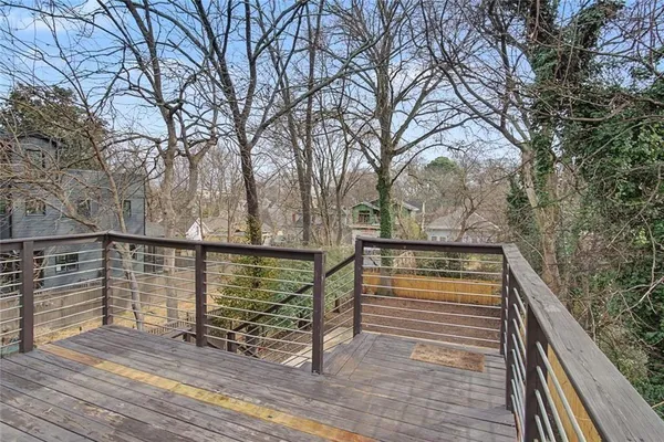 a view of deck with mountain and wooden floor