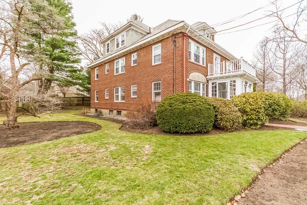 20 Buckminster Road, Unit 1 Brookline, MA 02445 - Photo 1 of 16 a view of a house with a yard