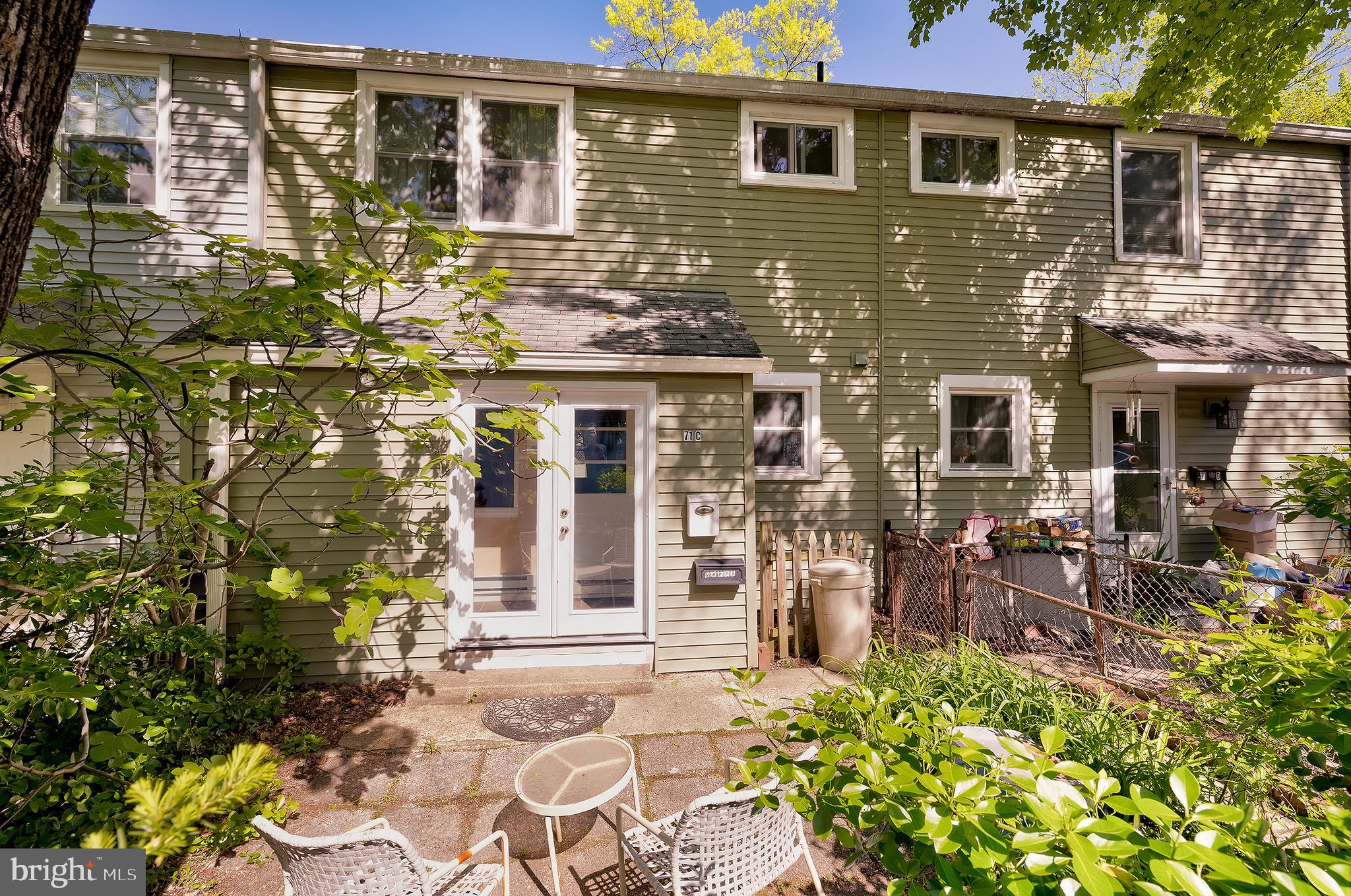 front view of a brick house with a large windows