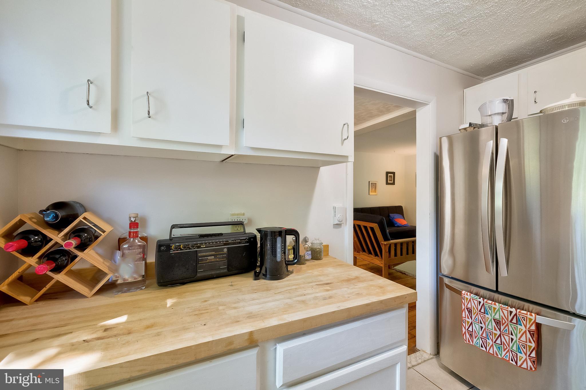 71 Ridge Road Greenbelt, MD 20770 - Photo 12 of 24 a kitchen with refrigerator and cabinets