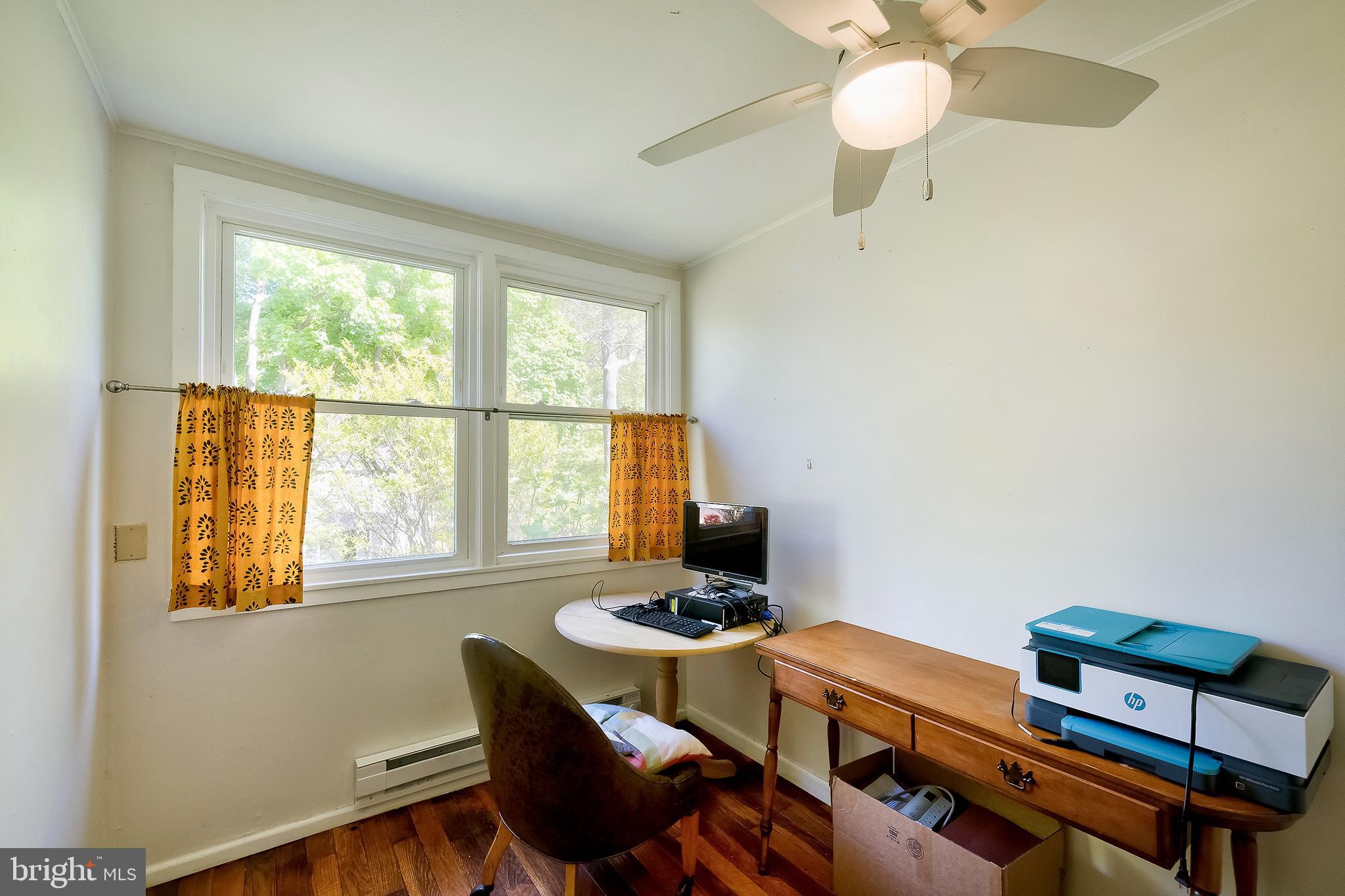 71 Ridge Road Greenbelt, MD 20770 - Photo 17 of 24 a living room with furniture and a window