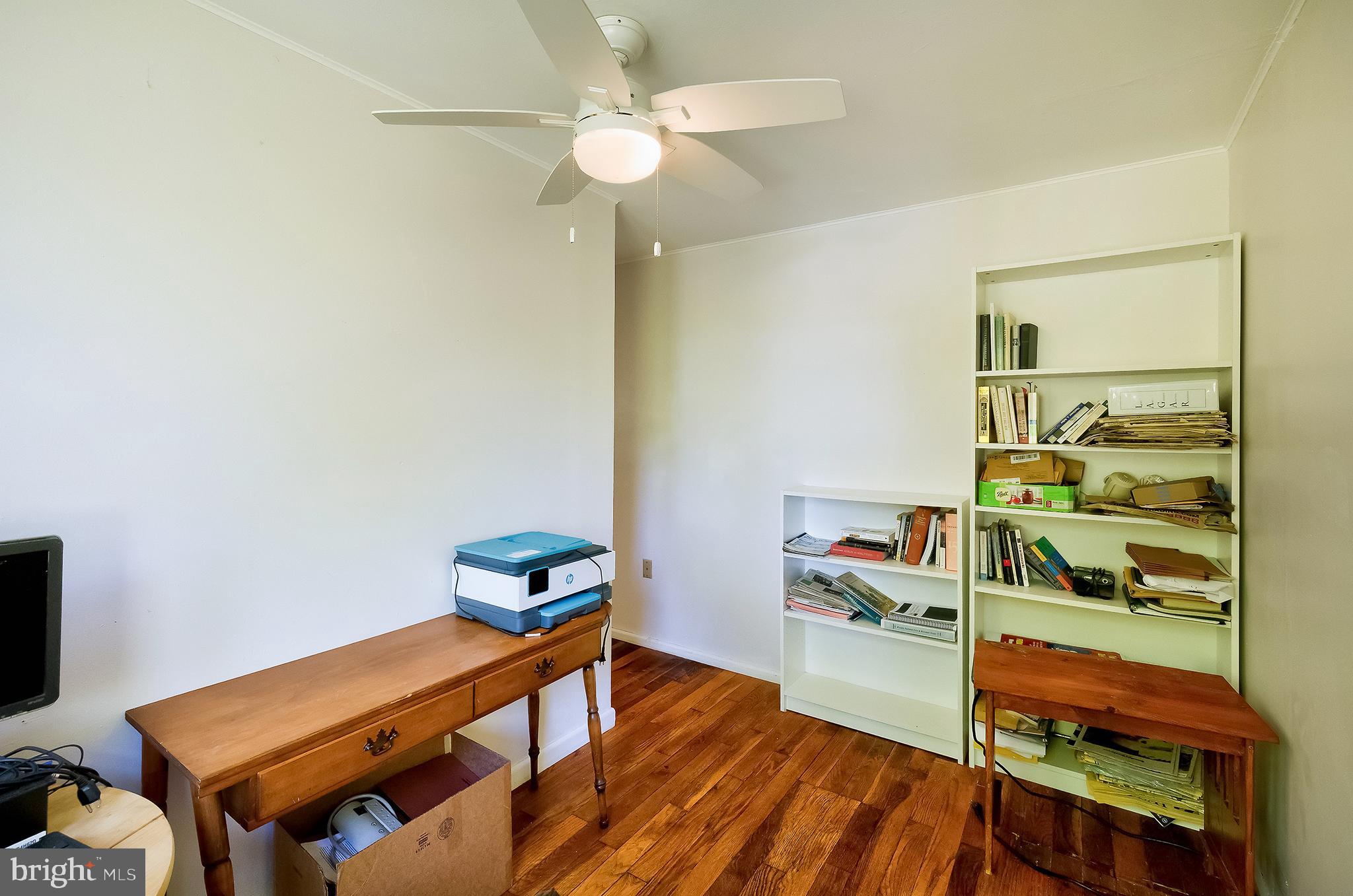 71 Ridge Road Greenbelt, MD 20770 - Photo 18 of 24 a room with furniture and a wooden floor
