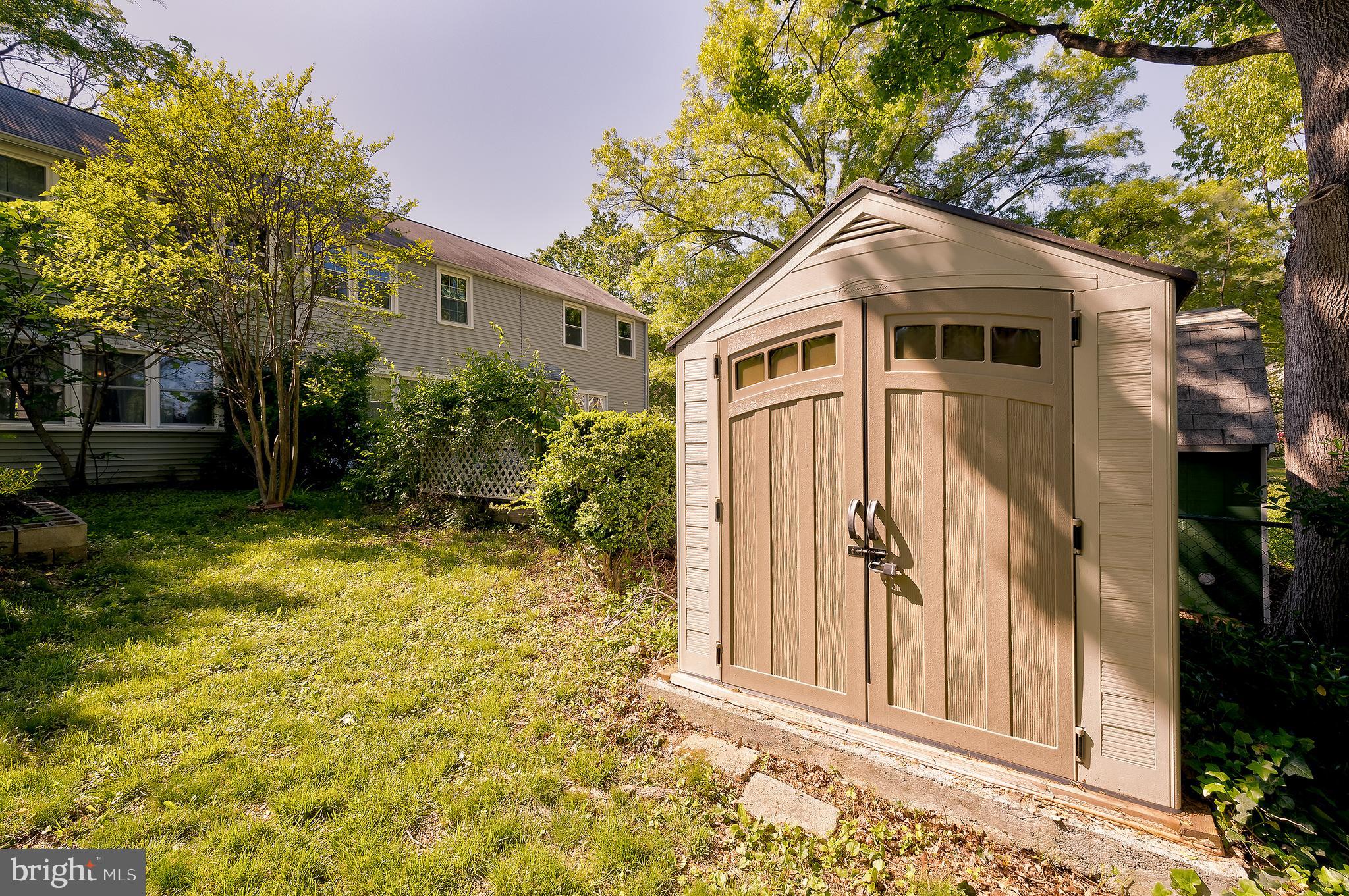 71 Ridge Road Greenbelt, MD 20770 - Photo 23 of 24 a front view of a house with garden