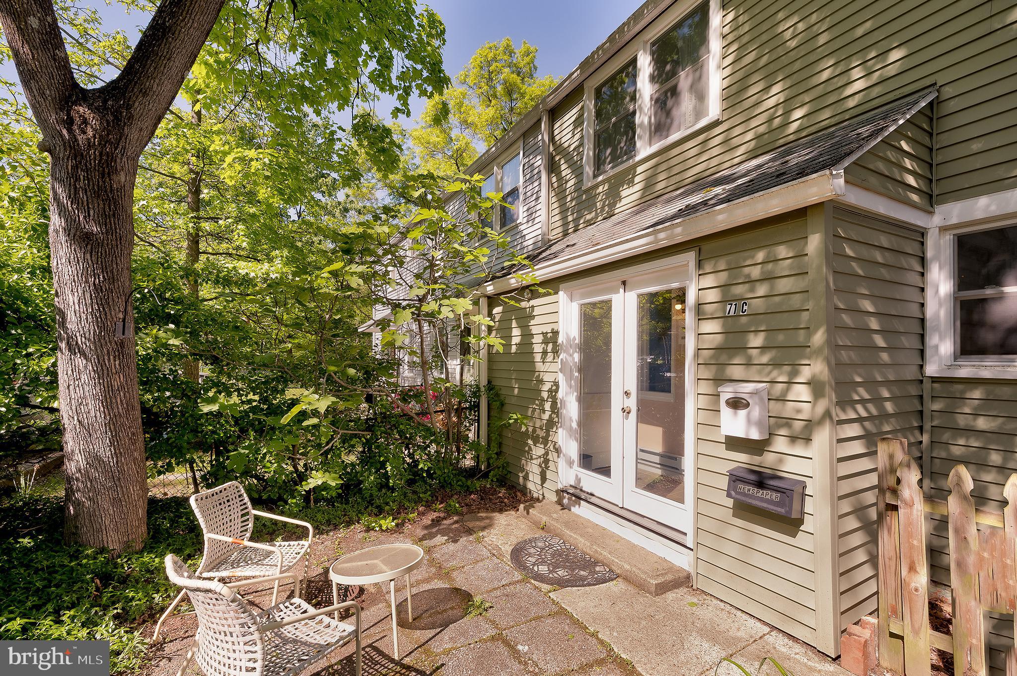 71 Ridge Road Greenbelt, MD 20770 - Photo 3 of 24 a view of a patio with table and chairs and potted plants
