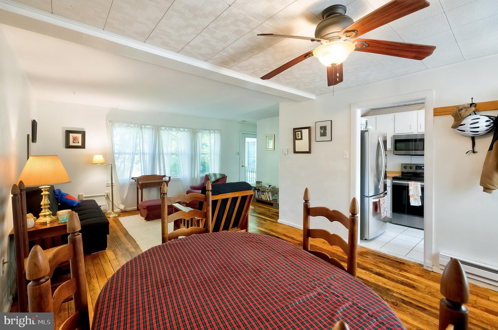 71 Ridge Road Greenbelt, MD 20770 - Photo 6 of 24 a living room with furniture a chandelier fan and a rug