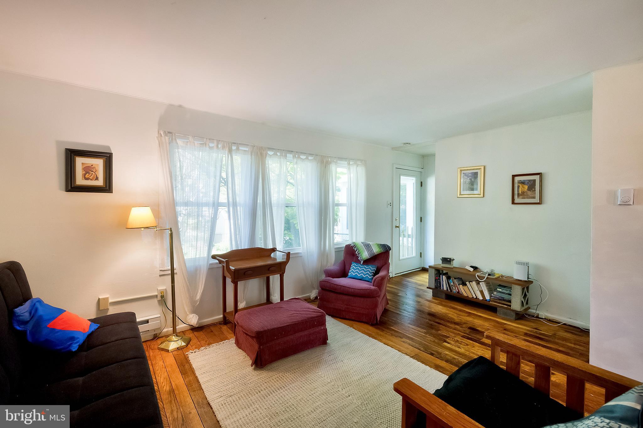 71 Ridge Road Greenbelt, MD 20770 - Photo 8 of 24 a living room with furniture rug and a window