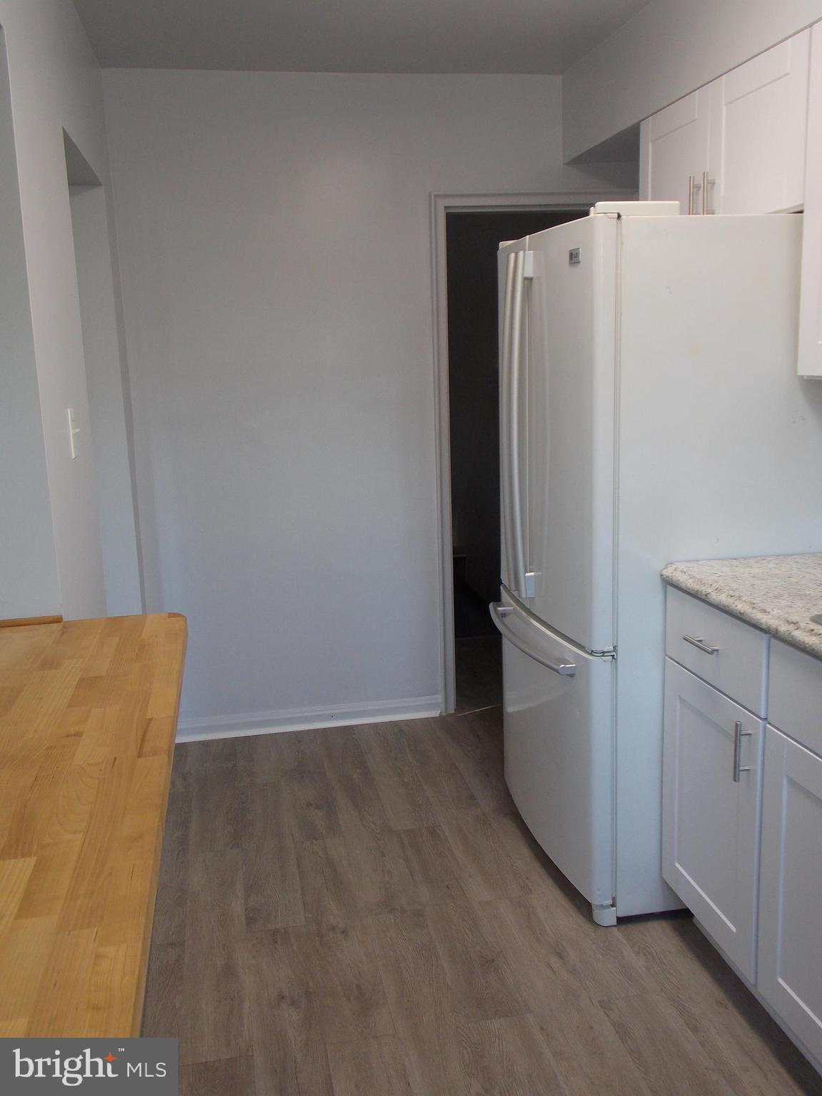 7713 Wynbrook Road Baltimore, MD 21224 - Photo 3 of 18 Kitchen with door to basement