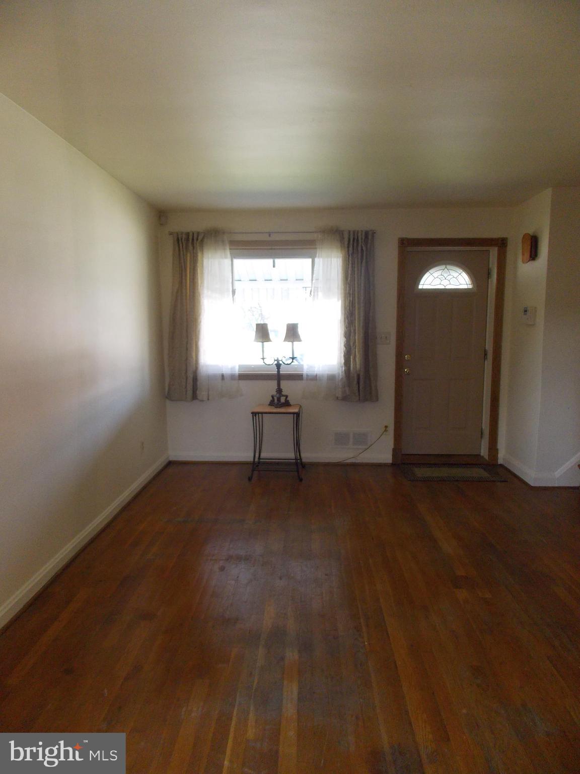 7713 Wynbrook Road Baltimore, MD 21224 - Photo 6 of 18 Living room (from dining room)