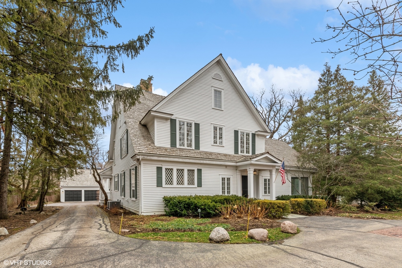1241 Edgewood Road Lake Forest, IL 60045 - Photo 2 of 46 a front view of a house with garden