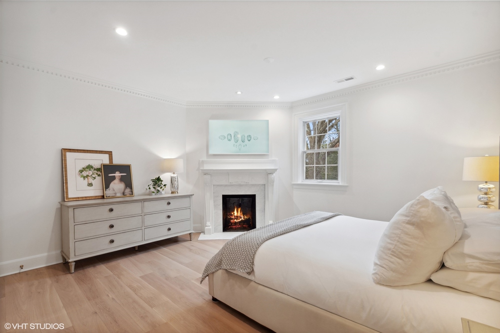 1241 Edgewood Road Lake Forest, IL 60045 - Photo 27 of 46 a bedroom with a bed and a fireplace