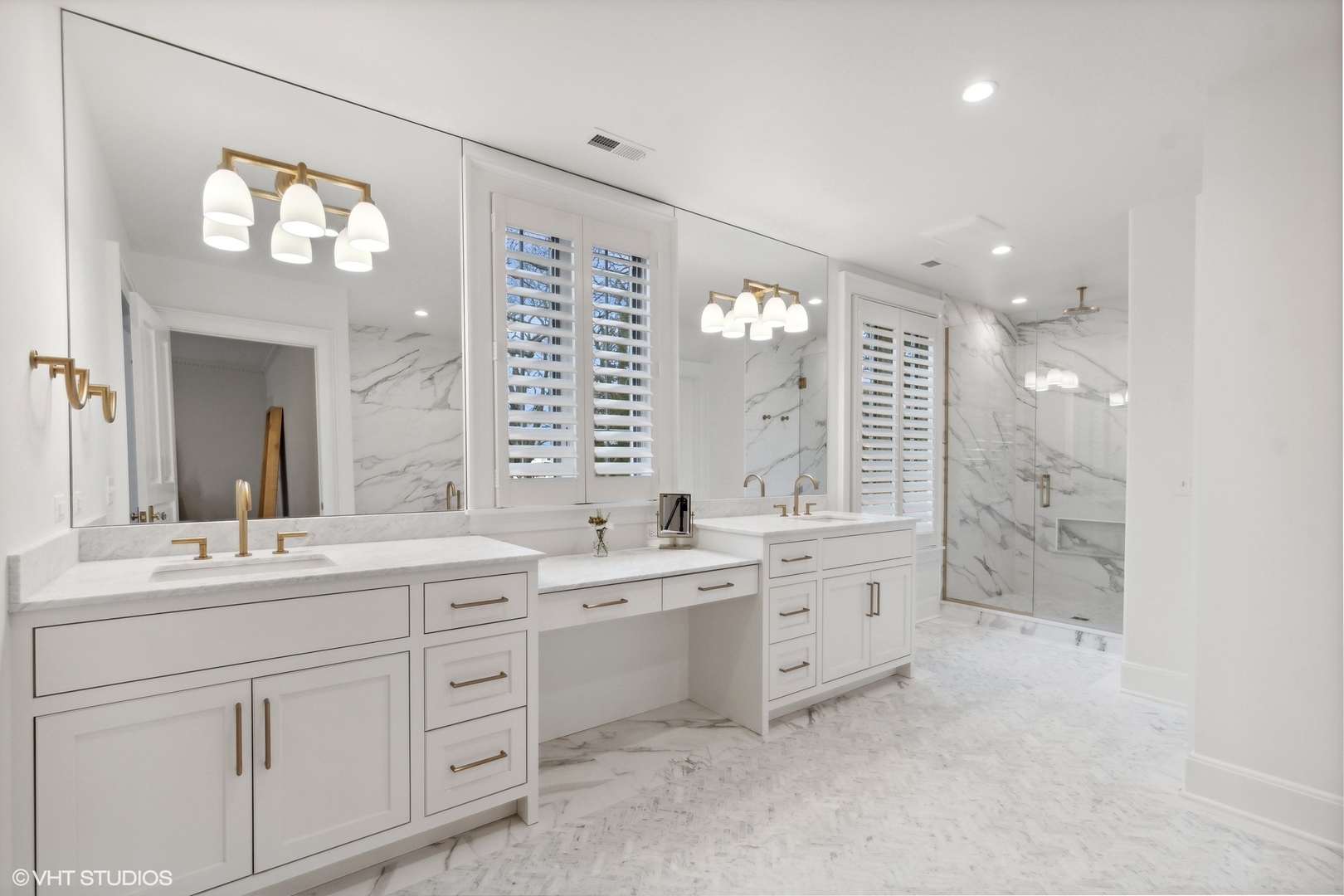 1241 Edgewood Road Lake Forest, IL 60045 - Photo 28 of 46 a bathroom with a double vanity sink a mirror a bathtub and window